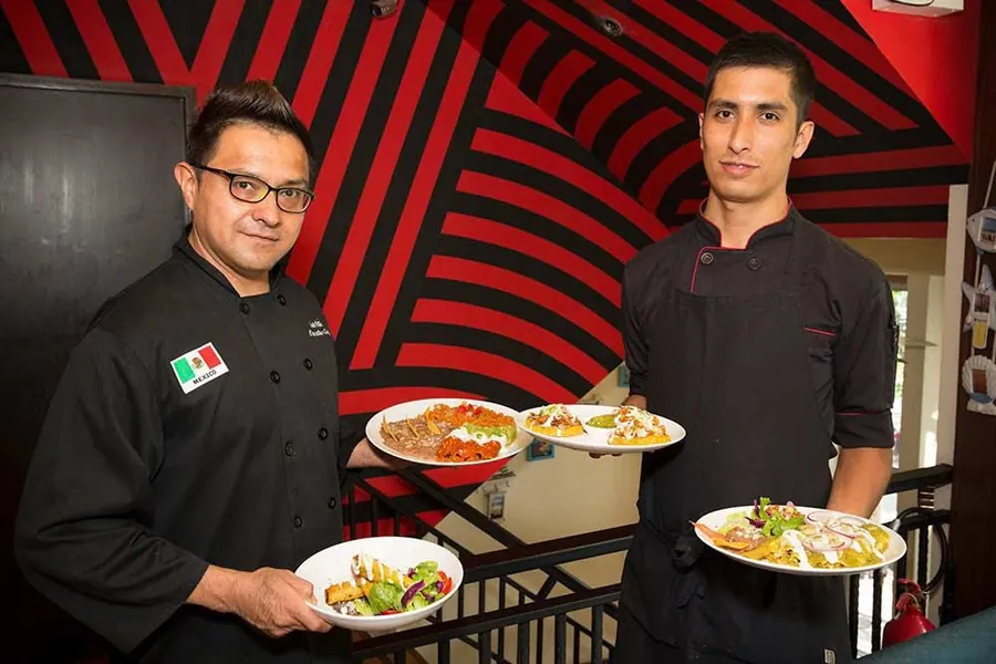 Sunrise Tacos chefs serving dishes